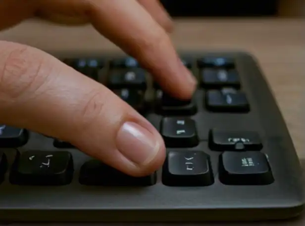 Laptop user typing on touchscreen keyboard with ease
