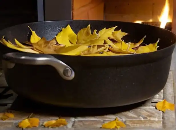 Golden leaves on a sizzling skillet with delicate flowers