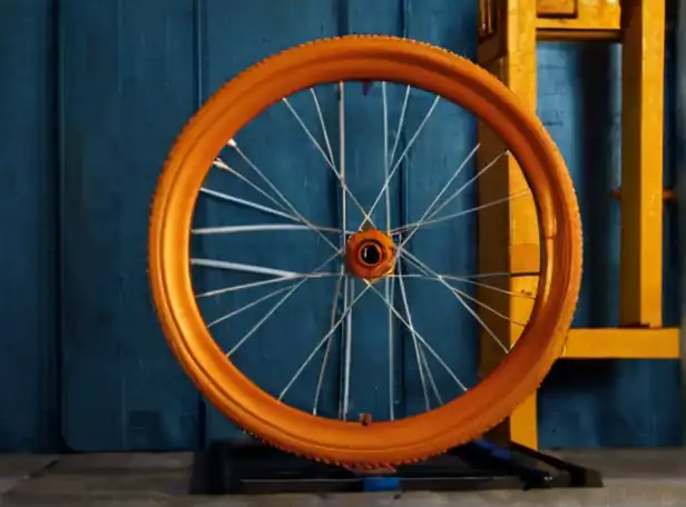 Bike wheel installation tutorial in a workshop background