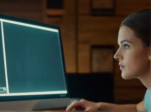A person in front of a computer with a clear screenshot