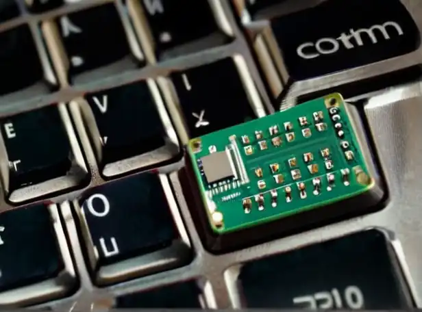 Computer keyboard and processor chip with binary code background