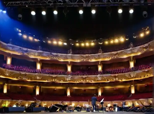 Musicians on stage at Palau Sant Jordi concert hall