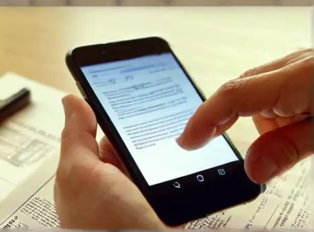 A person checking a document with a smartphone