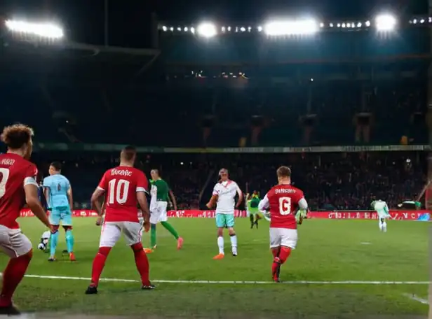 Football players in intense stadium action