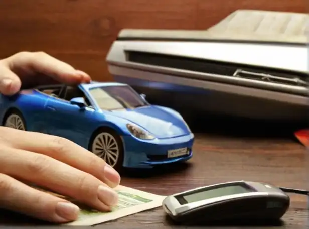 Car owner paying registration fee at a desk