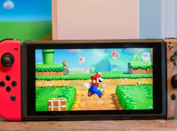 Mario characters on Nintendo Switch console playing games