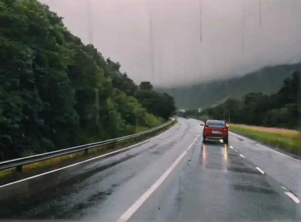 Rainy road with slow-moving vehicles