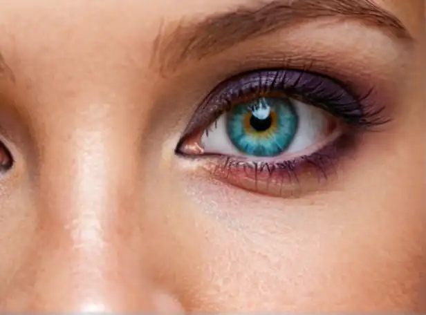 Colorful eyes with two distinct colors in a subtle smile